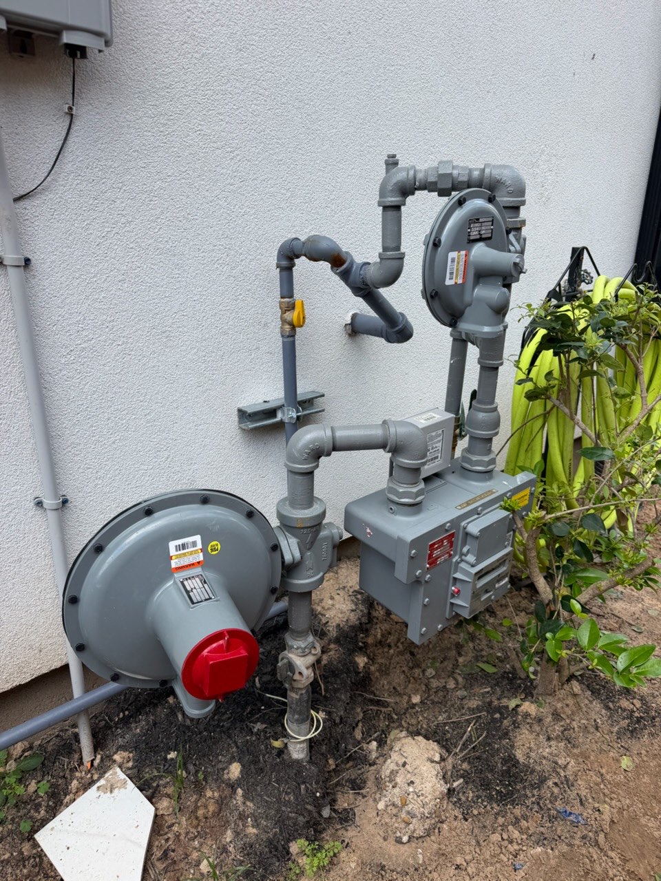 Natural gas meter, regulator, and piping for a standby generator hookup in Houston